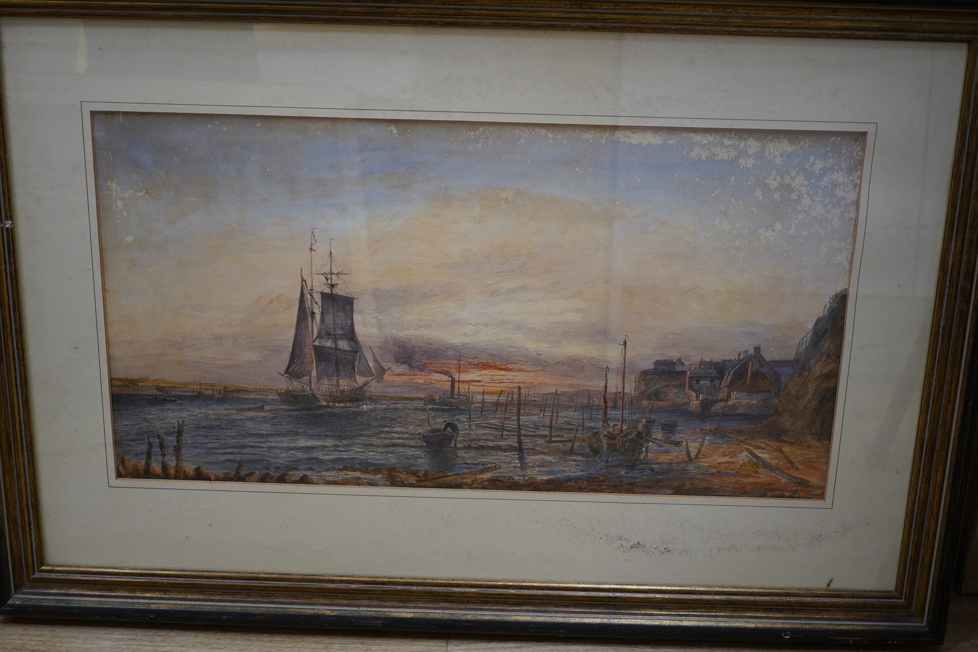 Two late 19th / early 20th century watercolours, comprising Harbour scene with figures and fishing boats and rocky coastal view, one indistinctly signed, largest 30 x 59cm. Condition - poor